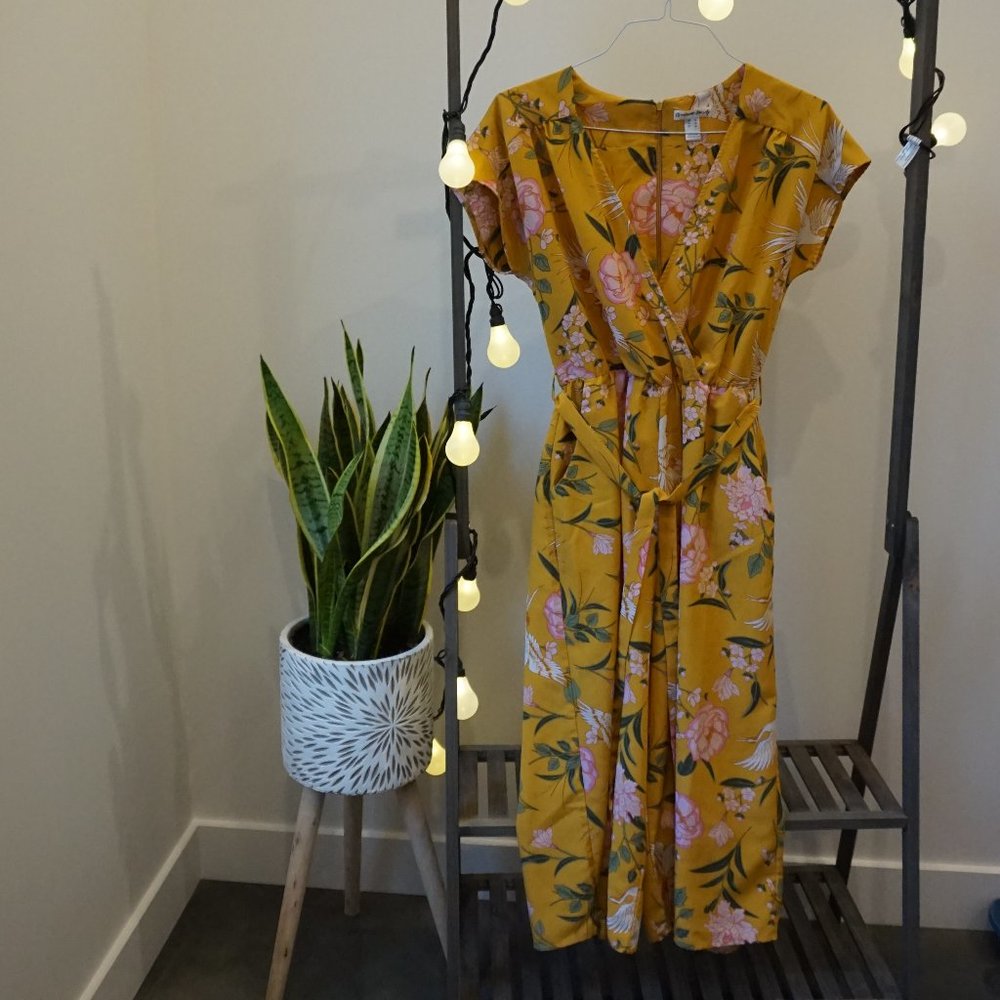 Yellow one piece with floral patterns